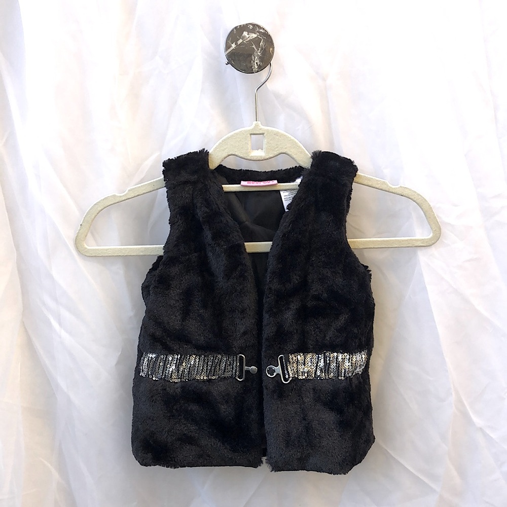 Cute fuzzy vest for young child with silver buckle